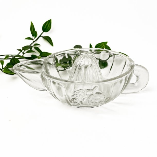 Klar vintage citruspresser i presset glas