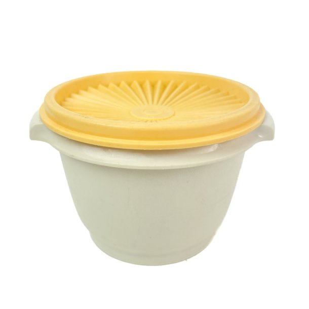 Vintage Tupperware plastb�tte med gul l�g