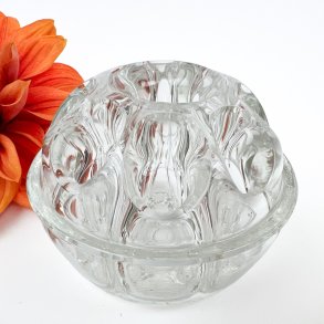 Dekorativ vintage blomsterfakir i glas