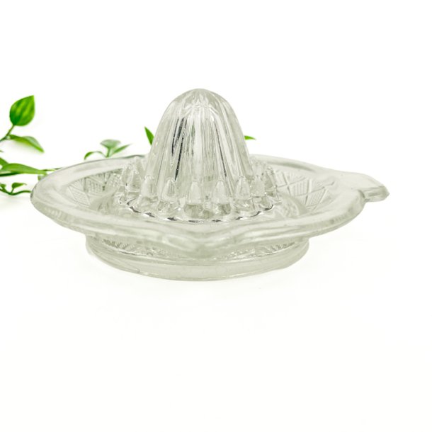 Vintage citronpresser i presset glas