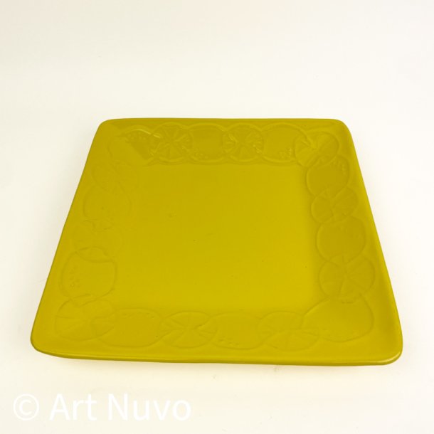 Gult retro serveringsfad med citroner