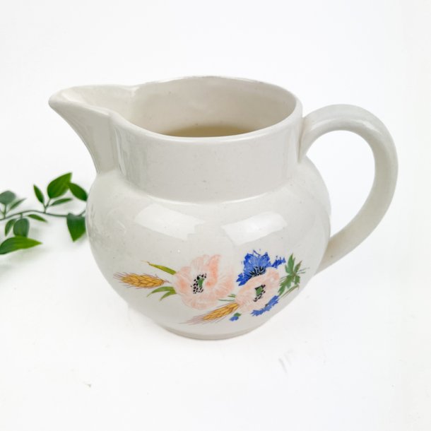 Vintage fajancekande blomster