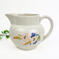 Vintage fajancekande blomster