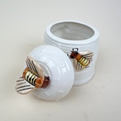 Vintage honningkrukke med bier