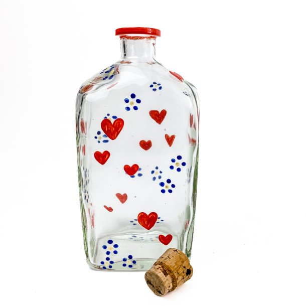Vintage glasflaske med hjerter