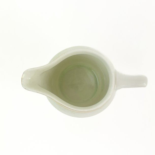 Lille vintage kande med blomsterbort