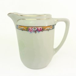 Lille vintage kande med blomsterbort