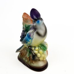 Retro fuglefigur med vindruer