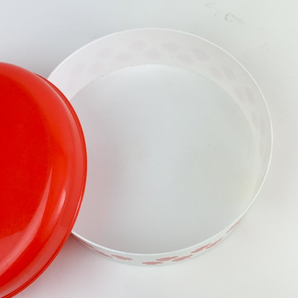Rote und weie Retro Dose mit Kleeblattmotiv