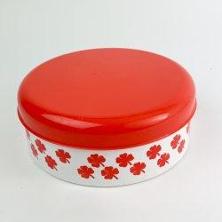 Rote und weie Retro Dose mit Kleeblattmotiv