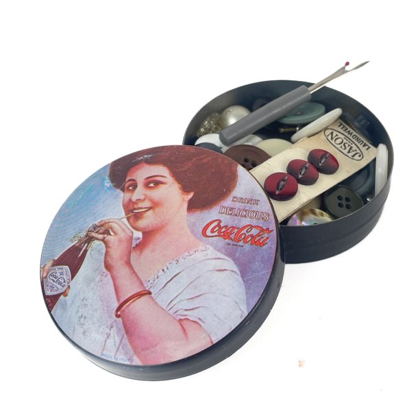 Rund vintage Coca-Cola ske med syting