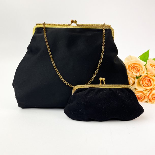 Schwarze Vintage-Clutch und Geldbrse