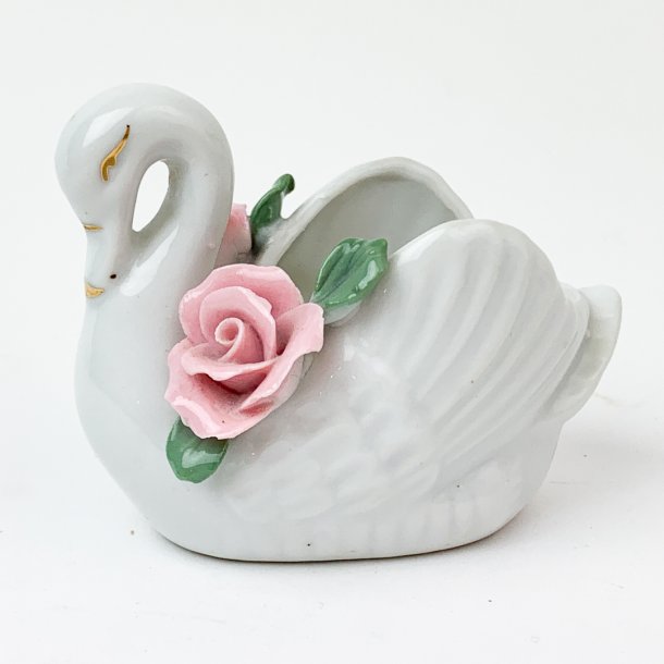 Porzellanschwan mit rosa Blumen