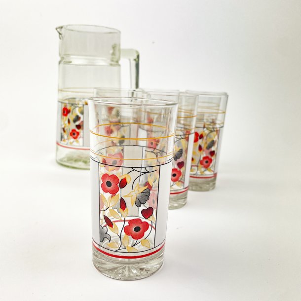 Seks glas og kande med blomstermotiv