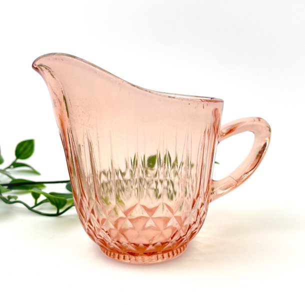 Rosa vintage fldekande i presset glas